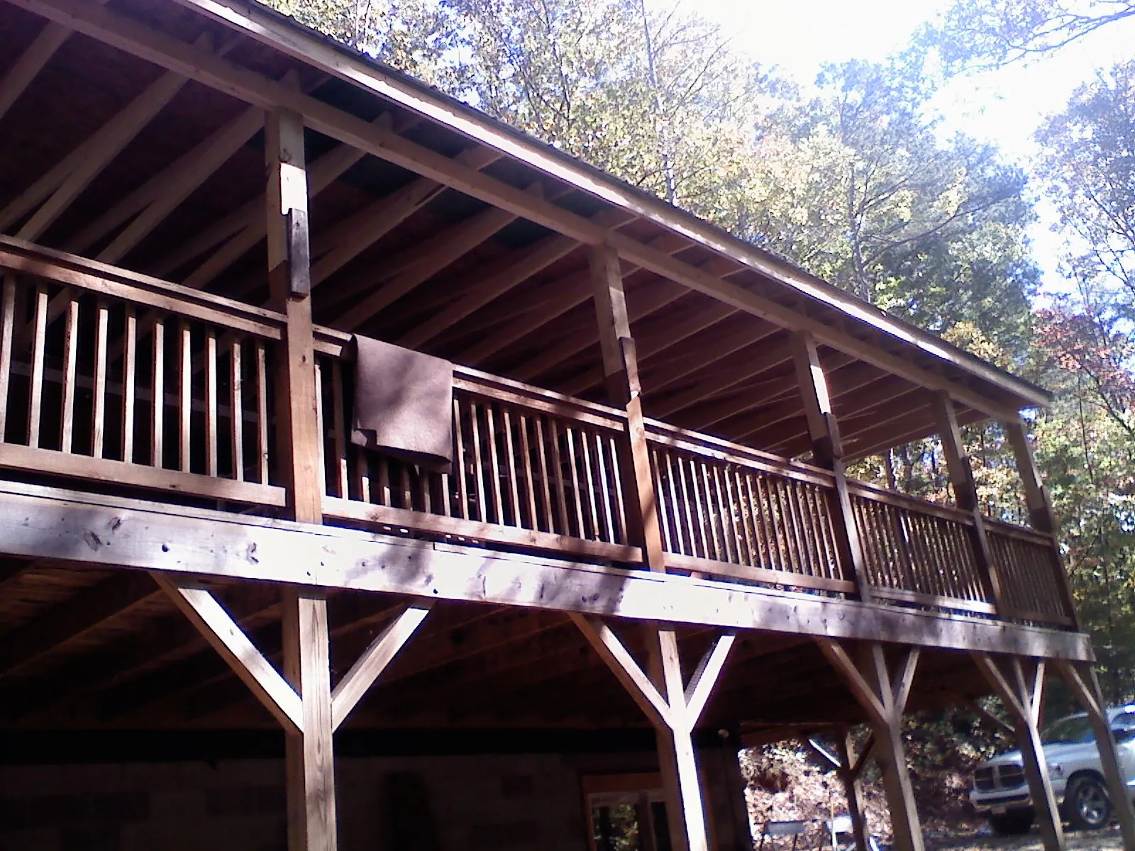 Timber framing under a new elevated porch and deck — Roof Leak Repair in Lowpoint by Roofing Brothers